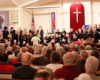 The Stambaugh Chorus performs O Holy Night under the direction of Dr. Hae-Jong Lee as part of the Concerts Under the Dome at First Presbyterian Church in Columbiana on Sunday night. EMILY MATTHEWS | THE VINDICATOR