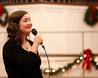 Ava Wilson, a high school sophomore from Poland, sings The First Noel as part of the Concerts Under the Dome at First Presbyterian Church in Columbiana on Sunday night. EMILY MATTHEWS | THE VINDICATOR