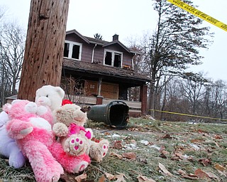 William D. Lewis The Vindicator Stuffed animals mark a memorial where 5 people died in a house fire early this morning 12-10-18 in Youngstown.