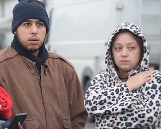 William D. Lewis The Vindicator Justin Viera and Deborah Rivera, neighbors to a fatal fire on Parkcliff in Youngstown describe the scene where five people died in an early morning house fire.