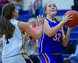 LOWELLVILLE, OHIO - DECEMBER 10, 2018: Western Reserve's Alyssa Screwsky goes to the basket against Lowellville's Sammie Kelly during the first half of their game, Monday night at Lowellville High School. DAVID DERMER | THE VINDICATOR