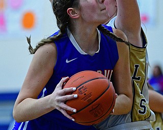 LOWELLVILLE, OHIO - DECEMBER 10, 2018: Western Reserve's Dani Vuletich goes to the basket against Lowellville's Marah Bellis during the first half of their game, Monday night at Lowellville High School. DAVID DERMER | THE VINDICATOR