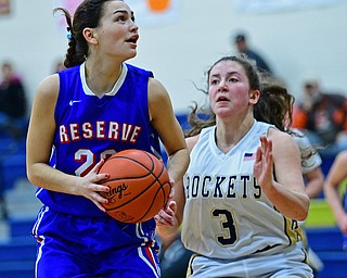 LOWELLVILLE, OHIO - DECEMBER 10, 2018: Western Reserve's Erica DeZee goes to the basket against Lowellville's Maddie Kelly during the first half of their game, Monday night at Lowellville High School. DAVID DERMER | THE VINDICATOR