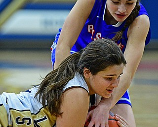 LOWELLVILLE, OHIO - DECEMBER 10, 2018: Lowellville's Sammie Moore and Western Reserve's Erica DeZee battle for a loose ball during the first half of their game, Monday night at Lowellville High School. DAVID DERMER | THE VINDICATOR