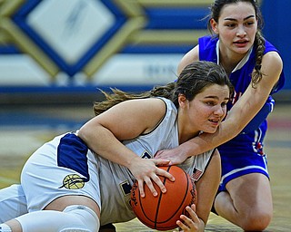 LOWELLVILLE, OHIO - DECEMBER 10, 2018: Lowellville's Sammie Moore and Western Reserve's Erica DeZee battle for a loose ball during the first half of their game, Monday night at Lowellville High School. DAVID DERMER | THE VINDICATOR