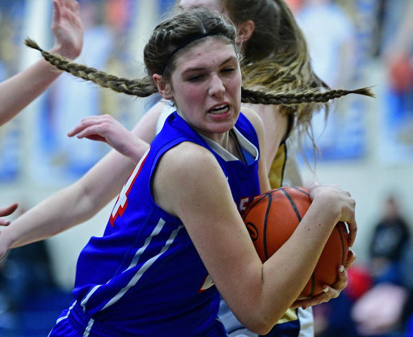 LOWELLVILLE, OHIO - DECEMBER 10, 2018: Western Reserve's Dani Vuletich grabs a rebound away from Lowellville defenders during the second half of their game, Monday night at Lowellville High School. DAVID DERMER | THE VINDICATOR