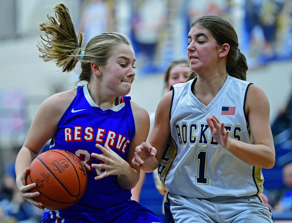 LOWELLVILLE, OHIO - DECEMBER 10, 2018: Western Reserve's Alyssa Screwsky drives on Lowellville's Sammie Kelly during the second half of their game, Monday night at Lowellville High School. DAVID DERMER | THE VINDICATOR