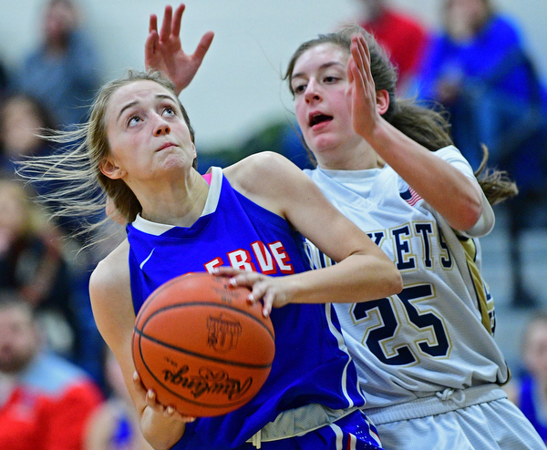 LOWELLVILLE, OHIO - DECEMBER 10, 2018: Wester Reserve's Maddy Owen goes to the basket against Lowellville's Kennedy Kelly during the second half of their game, Monday night at Lowellville High School. DAVID DERMER | THE VINDICATOR