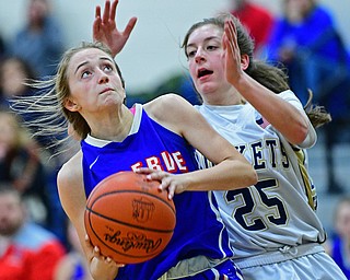 LOWELLVILLE, OHIO - DECEMBER 10, 2018: Wester Reserve's Maddy Owen goes to the basket against Lowellville's Kennedy Kelly during the second half of their game, Monday night at Lowellville High School. DAVID DERMER | THE VINDICATOR