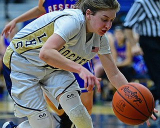 LOWELLVILLE, OHIO - DECEMBER 10, 2018: Lowellville's Kennedy Kelly reaches in an attempt to keep the ball from going out of bounds during the second half of their game, Monday night at Lowellville High School. DAVID DERMER | THE VINDICATOR