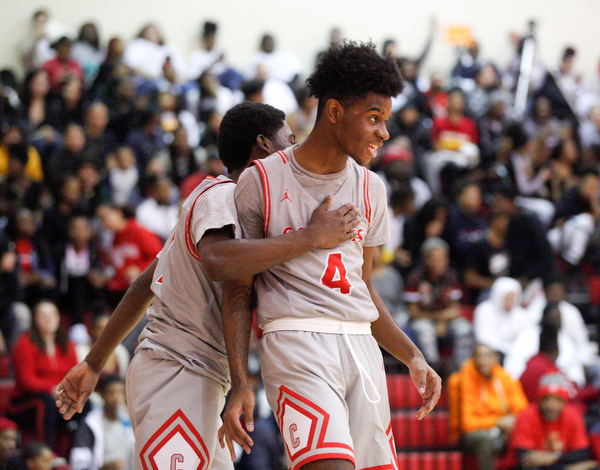 Chaney's Jamison Tubbs, left, and Ryan Clark celebrate during their game against East at Chaney High School on Tuesday night. EMILY MATTHEWS | THE VINDICATOR