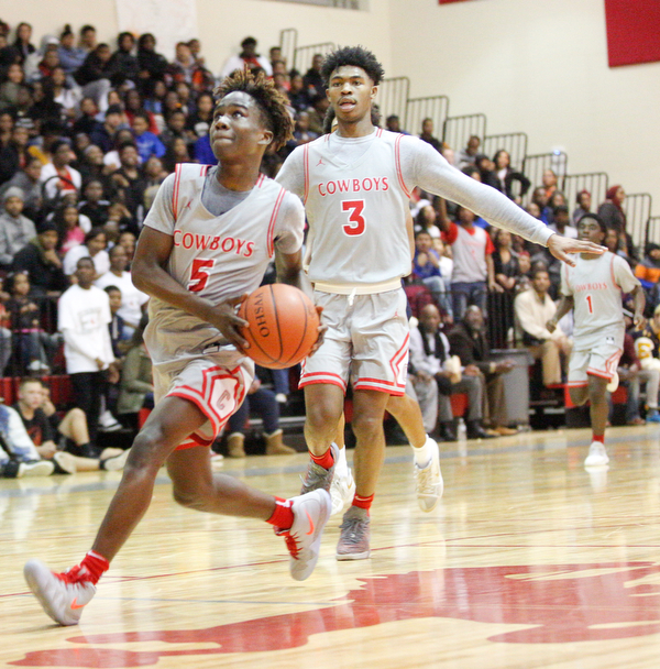 Chaney's Cameron Lawrence looks toward the hoop during their game against East at Chaney High School on Tuesday night. EMILY MATTHEWS | THE VINDICATOR