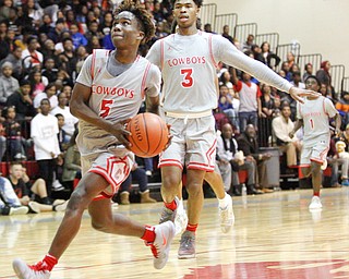 Chaney's Cameron Lawrence looks toward the hoop during their game against East at Chaney High School on Tuesday night. EMILY MATTHEWS | THE VINDICATOR