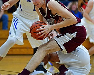 CORTLAND, OHIO - DECEMBER 11, 2018: Boardman's Ethan Andersen secures the ball while falling on top of Lakeview's Brendon Kilpatrick during the second half of their game, Tuesday night at Lakeview High School. DAVID DERMER | THE VINDICATOR