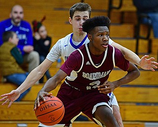 CORTLAND, OHIO - DECEMBER 11, 2018: Boardman's Derrick Anderson dribbles away from Lakeview's AJ McClellan after grabbing a rebound during the second half of their game, Tuesday night at Lakeview High School. DAVID DERMER | THE VINDICATOR