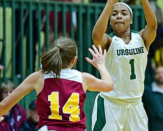 YOUNGSTOWN, OHIO - DECEMBER 12, 2018: Ursuline's Dayshanette Harris shoots over Mooney's Camden Hergenrother during the first half of their game, Wednesday night at Ursuline High School. DAVID DERMER | THE VINDICATOR