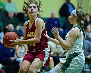 YOUNGSTOWN, OHIO - DECEMBER 12, 2018: Mooney's Camden Hergenrother prepares to shoot over Ursuline's Jamie Nelson during the first half of their game, Wednesday night at Ursuline High School. DAVID DERMER | THE VINDICATOR