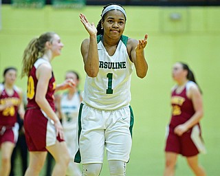 YOUNGSTOWN, OHIO - DECEMBER 12, 2018: Ursuline's Dayshanette Harris celebrates after forcing a Mooney turnover near center court during the second half of their game, Wednesday night at Ursuline High School. DAVID DERMER | THE VINDICATOR