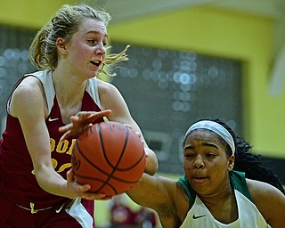 YOUNGSTOWN, OHIO - DECEMBER 12, 2018: Mooney's Katie Hough and Ursuline's Dayshanette Harris battle for a rebound during the second half of their game, Wednesday night at Ursuline High School. DAVID DERMER | THE VINDICATOR