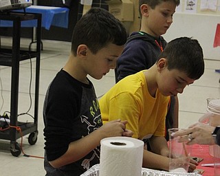 Neighbors | Abby Slanker.At a science station, Hilltop Elementary School third-graders measured materials to create instant snow during the school’s annual STEM Week.