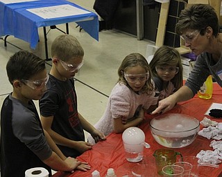 Neighbors | Abby Slanker.A group of Hilltop Elementary School third-graders learned about sublimation and chemical reaction using dry ice at a science station during the school’s annual STEM Week on Nov. 8.