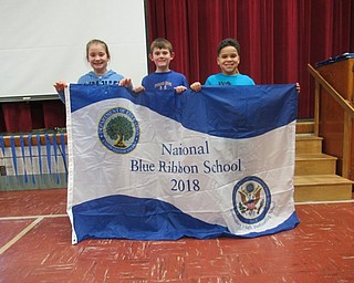 Neighbors | Jessica Harker.Students Ally Guerriero, Jessen Hoffman and Antonio McNutt were chosen to hold the honorary National Blue Ribbon School banner Nov. 16 at Stadium Drive Elementary School.