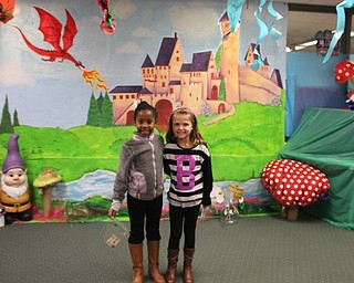 Neighbors | Abby Slanker.Two C.H. Campbell Elementary School second-grade students checked out the mural of a castle as they explored the school’s annual book fair with the theme ‘Enchanted Forest - Let Your Imagination Grow, Read.'