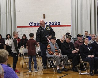 Neighbors | Abby Slanker.As is tradition, a C.H. Campbell Elementary School second-grader presented a veteran with a flag which had been flown over the grave of a veteran in one of Canfield’s cemeteries during the school’s annual Veterans Day Assembly.