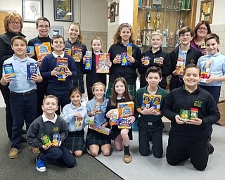 Neighbors | Submitted.Holy Family student council representatives with advisors Renee Abbattista and Lissa Oslin posed with canned food items for the St. Vincent DePaul food pantry. Pictured are, from left, (front) Joey Loree, Olivia Becker, Abigail Markey, Sophia Rotunno, J.D. Memo, Logan Hackstedde; (back) Marco Beato, Renee Abbattista, Brady Desmond, Braden Joss, Samantha Rotunno, Mia Schrickel, Cameron Burk, Constantine Stamp, Lissa Oslin and Cameron Hackstedde.