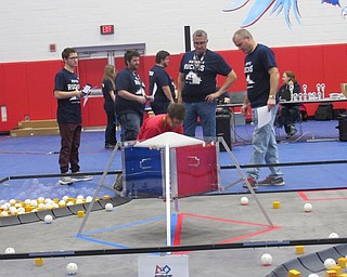 Neighbors | Jessica Harker .Members of the Austintown robotics team prepared for the first competition of the season on Dec. 1.