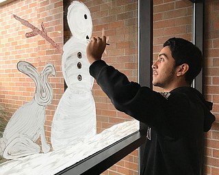 Neighbors | Submitted.Alan Cuevas, a student at Boardman High School, filled in the details on a snowman at Akron Children's Hospital.