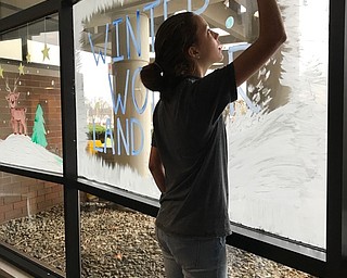 Neighbors | Submitted.Boardman student Sophia McGee painted windows near the entrance of Akron Children's Hospital in Boardman on Dec. 1.