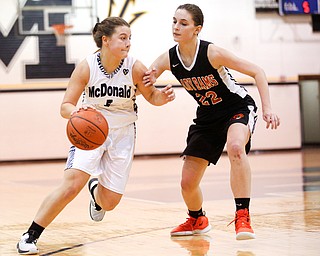 McDonald's Lucy Wolford dribbles the ball as Mineral Ridge's Fran Kesner tries to block her during their game at McDonald High School on Thursday night. EMILY MATTHEWS | THE VINDICATOR