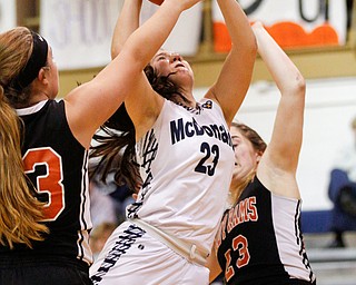 McDonald's Sophia Costantino shoots toward the hoop while Mineral Ridge's Morgan Sigley, left, and Alexa Harkins try to block her during their game at McDonald High School on Thursday night. EMILY MATTHEWS | THE VINDICATOR