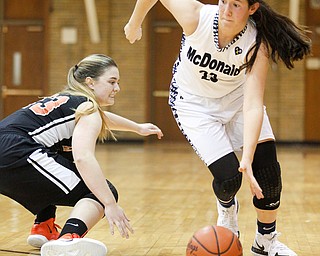 McDonald's Sophia Costantino dribbles the ball while Mineral Ridge's Alexa Harkins tries to grab the ball during their game at McDonald High School on Thursday night. EMILY MATTHEWS | THE VINDICATOR