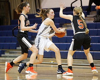 McDonald's Maddy Howard looks to pass the ball while Mineral Ridge's Fran Kesner, left, and Danielle Aulet, right, try to block her during their game at McDonald High School on Thursday night. EMILY MATTHEWS | THE VINDICATOR