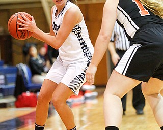 McDonald's Olivia Perry looks to pass the ball while Mineral Ridge's Morgan Sigley tries to block her during their game at McDonald High School on Thursday night. EMILY MATTHEWS | THE VINDICATOR