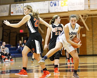 McDonald's Olivia Perry catches the ball and pulls it away from Mineral Ridge's Noelle Bukovina during their game at McDonald High School on Thursday night. EMILY MATTHEWS | THE VINDICATOR