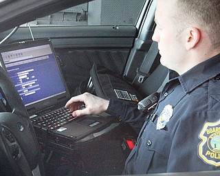 William D. Lewis The vindicator Boardman PTLM Evan Beil uses new dispatch gear in a cruiser 12-13-18.