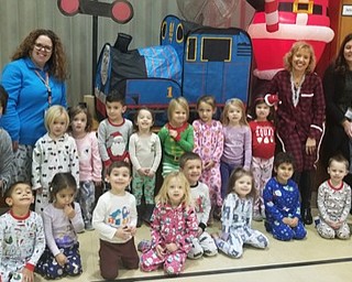 Neighbors | Submitted.Preschool teachers Joy Bucci and Terry Wittenaur posed with their classes in front of the pop up train for Polar Express Day Dec. 7 at Poland Union Elementary School.