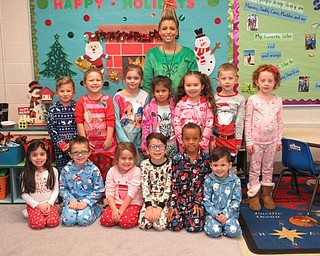 Neighbors | Jessica Harker.Preschool teacher Samantha Cox dressed as Cindy Lou Who while her class dressed in their pajamas to celebrate Polar Express day Dec. 7 at Poland Union Elementary School.