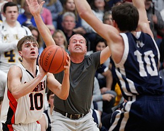 Springfield's Clay Medvec looks to pass the ball while McDonald's Josh Celli tries to block him and McDonald's Coach Jeff Rasile motions off court during their game at Springfield on Friday night. EMILY MATTHEWS | THE VINDICATOR