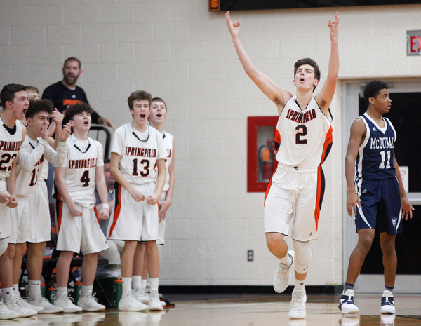 Springfield's Drew Clark (2) and his teammates celebrate during their game against McDonald at Springfield on Friday night. EMILY MATTHEWS | THE VINDICATOR