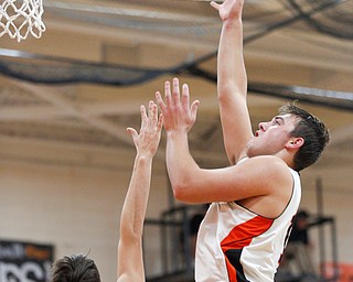 Springfield's Shane Eynon shoots the ball while McDonald's Dominic Carkido tries to block him during their game at Springfield on Friday night. EMILY MATTHEWS | THE VINDICATOR