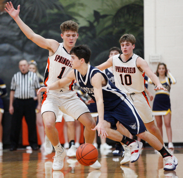 McDonald's Zach Rasile dribbles the ball while Springfield's Evan Ohlin, left, and Clay Medvec try to block him during their game at Springfield on Friday night. EMILY MATTHEWS | THE VINDICATOR