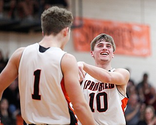 Springfield's Clay Medvec (10) and Evan Ohlin celebrate during their game against McDonald at Springfield on Friday night. EMILY MATTHEWS | THE VINDICATOR