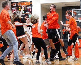 Springfield's student section rushes onto the court and celebrates after Springfield beat McDonald 87-71 on Friday night at Springfield High School. EMILY MATTHEWS | THE VINDICATOR