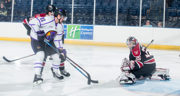 Scott R. Galvin | The Vindicator.Youngstown Phantoms forward Brett Murray (21) scores the team's first goal of the game against Chicago Steel goalie Reilly Herbst (35) during the first period at the Covelli Centre on Saturday, Dec. 15, 2018.