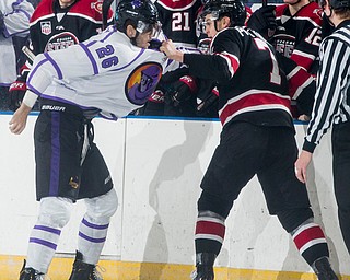 Scott R. Galvin | The Vindicator.Youngstown Phantoms forward Josh DeLuca (26) gets in a fight with Chicago Steel defenseman Matteo Pietroniro (7) during the first period at the Covelli Centre on Saturday, Dec. 15, 2018.