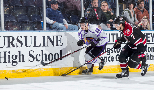 Scott R. Galvin | The Vindicator.Youngstown Phantoms forward Ben Schoen (19) skates past Chicago Steel defenseman Matteo Pietroniro (7) for the puck during the second period at the Covelli Centre on Saturday, Dec. 15, 2018.